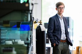 Connor Coley standing in the lab